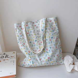 Floral cotton tote bag for women featuring colorful print and double handles design