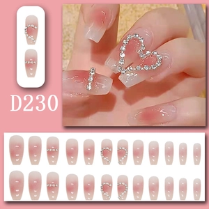 Pink gradient press-on nails set with heart rhinestones and 3D water drop details