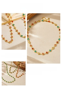 Detail of 18K gold stainless steel necklace with colorful heart-shaped crystal gems