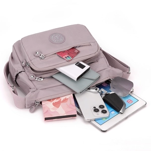Lavender oxford nylon crossbody bag with multiple zip pockets and daily essentials storage