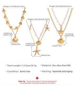 Detailed view of bohemian triple-layer necklace with starfish, shell and pearl accents