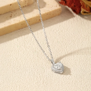 S925 sterling silver heart necklace with 1 carat moissanite on elegant beige background