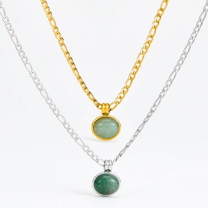 Vintage gold and silver necklaces with green aventurine oval pendants on white background