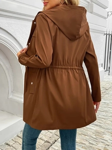 Detailed view of dark brown hooded windbreaker with adjustable waist drawstring and metal snaps