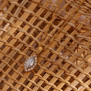 Detail of gold leaf necklace featuring marquise zircon and sparkling pavé crystals