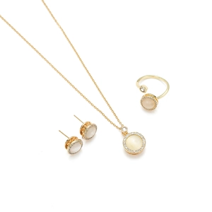 Elegant gold titanium jewelry set with rotatable cat eye stones and cubic zirconia accents