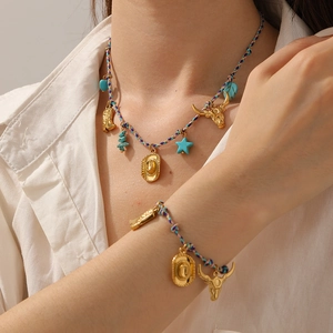 Detail of bohemian gold-plated chain necklace with western-style turquoise pendants