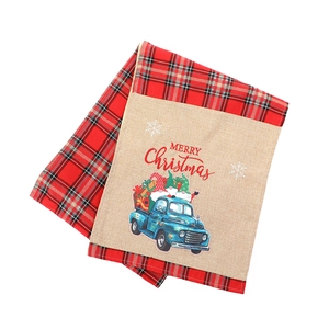 Christmas table runner with red plaid, vintage blue truck and gnomes on linen fabric