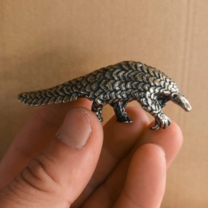 Miniature vintage brass pangolin desktop ornament with detailed scale textures