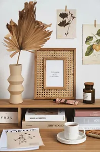 Close-up of Japanese style rattan picture frame with natural wood and woven texture