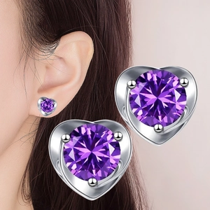 Close-up of heart-shaped purple zircon earrings with silver plating for women