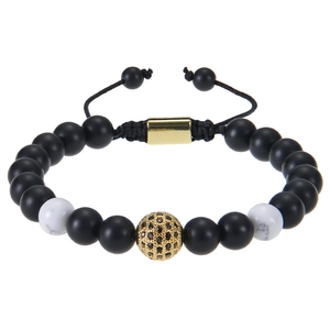 Detail of tiger eye beads with gold cubic zirconia ball and adjustable woven cord