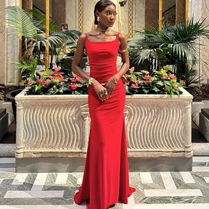Detailed view of red slim fit evening dress with backless design and mermaid silhouette