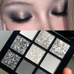 Detailed view of 9-color matte and glitter eyeshadow palette with cool smoky eye makeup