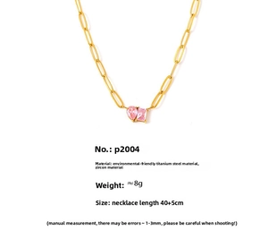 Detail view of 18k gold plated necklace with pear and rectangular pink zircon pendants