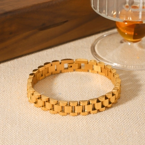 Bracelet luxueux en acier inoxydable plaqué or 18 carats avec maillons de montre sur tissu