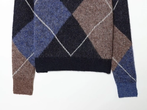 Close-up of diamond argyle pattern knit sweater with soft mohair wool texture