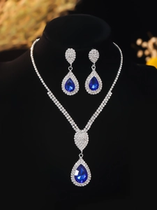 Detailed view of luxury bridal set with blue teardrop crystals and silver rhinestones