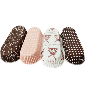 Macro detail of assorted greaseproof boat-shaped cupcake liners with windmill patterns