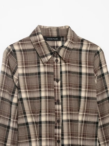 Detail of the classic brown plaid shirt showing the collar and Indefeir brand label