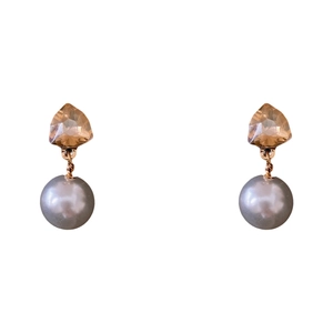 Elegant geometric champagne crystal earrings with grey round pearls on a white background