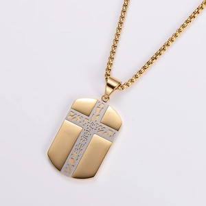 Detailed view of two-tone stainless steel cross pendant necklace with golden box chain