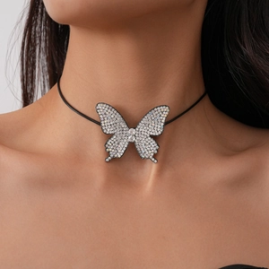 Close-up of a large rhinestone butterfly pendant choker on a model's neck with AB finish