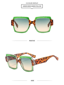 Detail of square sunglasses with green glitter, orange leopard print and gradient lenses