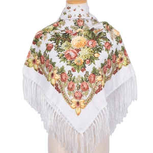 Detail view of white ethnic scarf featuring large floral print and long white tassels