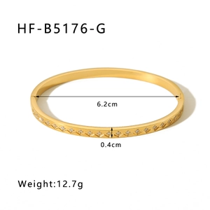 Detail view of 18k gold plated stainless steel bangle with dimensions 6.2cm and 12.7g
