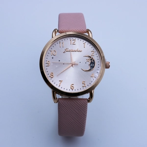 Women's quartz watch with pink leather strap, rose gold case, and moon star dial detail