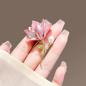 Elegant Chinese style magnolia flower brooch with pink enamel petals and pearl detail