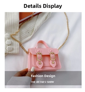 Close-up of pink jelly crossbody bag with gold chain strap and magnetic buckle