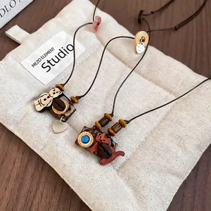 Handmade wooden kitten and bear pendants with coffee beans on brown cord necklaces