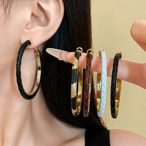 Chic C-shaped acrylic hoop earrings in black, white, and leopard print with gold accents