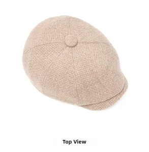 Top view of beige flat cap showing detailed cotton linen woven texture and button