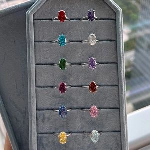 S925 silver rings with colorful oval zircon gemstones displayed on a velvet tray