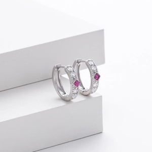 Detailed macro view of S925 silver hoop earrings with rose red square zircons