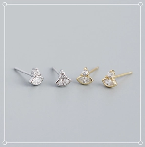 Macro detail of gold and silver S925 sterling silver marquise zircon stud earrings