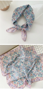 Detail of floral linen-cotton square scarf with decorative wavy orange borders