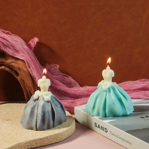 Detailed view of elegant wedding dress scented candles in grey and mint green