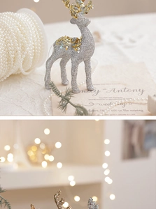 Detailed view of a silver glitter reindeer figurine for Christmas and wedding decor