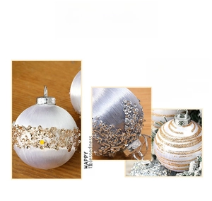 Macro detail of white silk fiber Christmas foam balls with gold and silver sequins