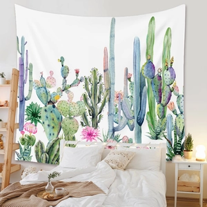 Detail of bohemian wall tapestry featuring watercolor cacti and floral botanical prints