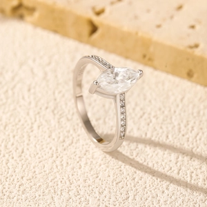 S925 sterling silver marquise cut 1 carat moissanite ring on natural stone background