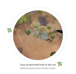 Close-up of PET floral stickers showing precision die-cut details and tweezers use