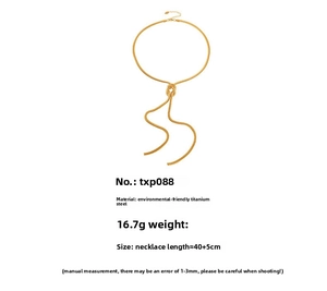 Detail of gold-plated titanium snake chain necklace featuring unique knot design and tassels