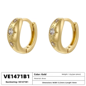 Detailed view of gold plated brass C-shaped ear cuff with sparkling star set crystals