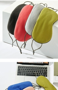 Detail of breathable mesh sleep masks in multiple colors on a desk for office naps