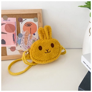 Detail of cute rabbit plush crossbody bag for girls in ginger yellow sherpa fabric